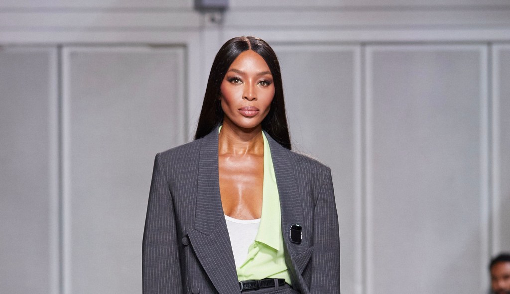Naomi Campbell wearing a Humane pin