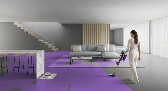 woman vacuuming living room