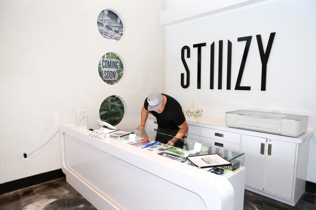 View of custom engraving station at Shryne Group's STIIIZY Flagship Store