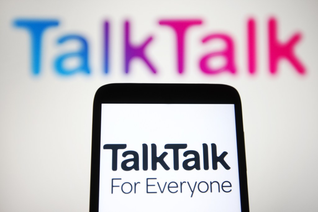TalkTalk Telecom Group plc (or TalkTalk Group) logo is seen on a smartphone and a pc screen.