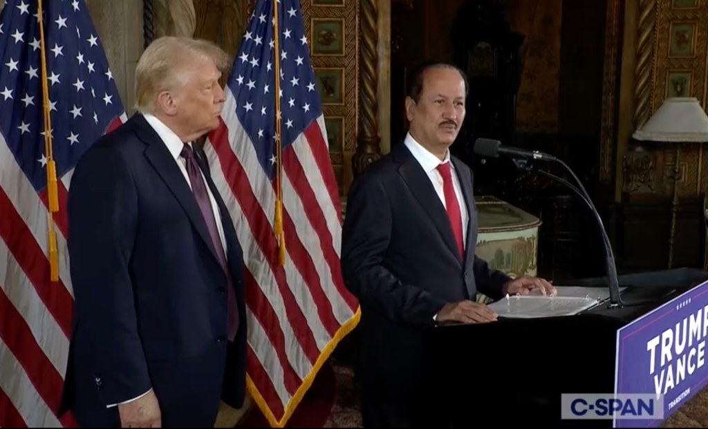 a screenshot of a CSPAN feed showing Trump next to billionaire Hussain Sajwani at a podium in Mar-a-Lago