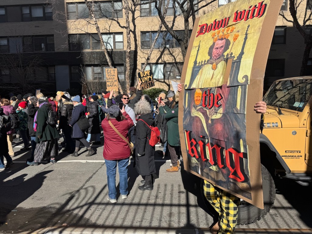 presidents day protest' 'down with the king' sign