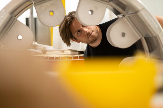 An engineer inspects a stage of Pacific Fusion's fusion reactor.