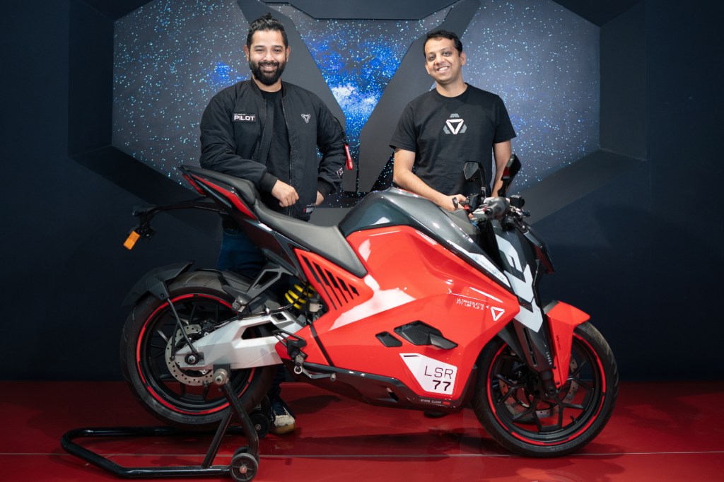 Ultraviolette founders posed with a motorcycle