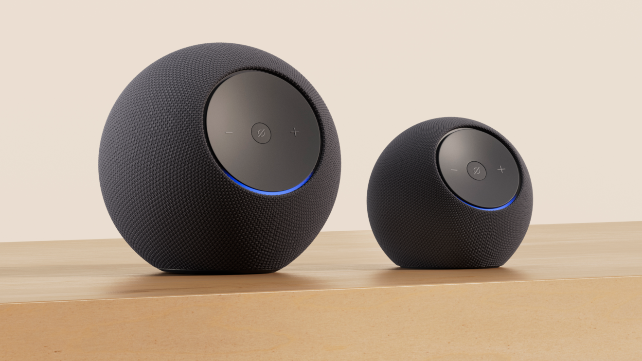 a photo showing two Amazon Echo devices, a large model and a smaller model.